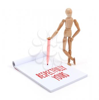 Wooden mannequin writing in a scrapbook - Respectfully yours