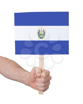 Hand holding small card, isolated on white - Flag of El Salvador