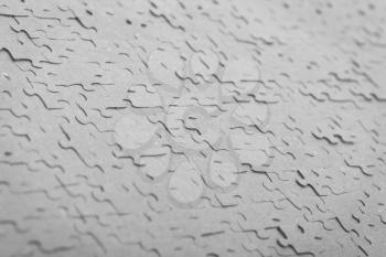 Old puzzle - Pieces connected - Selective focus on the middle - Grey