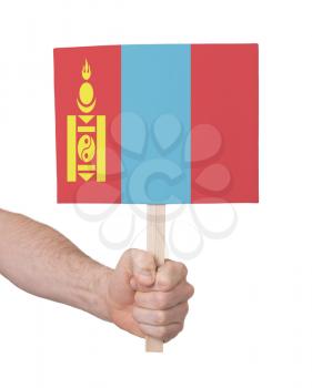 Hand holding small card, isolated on white - Flag of Mongolia
