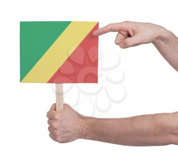 Hand holding small card, isolated on white - Flag of Congo