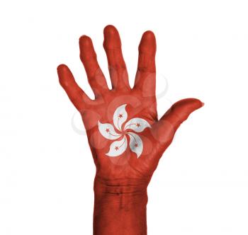 Palm of a woman hand, painted with flag of Hong Kong