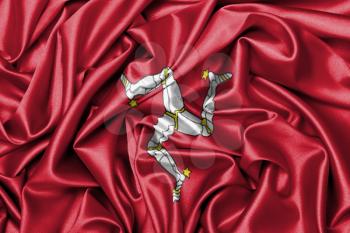 Large satin flag waving - flag of the Isle of Man