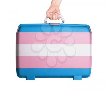 Used plastic suitcase with stains and scratches, printed with flag - Trans Pride