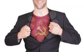 Businessman opening suit to reveal shirt with flag, USSR