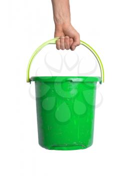 Human hand holding empty plastic pail, isolated on white