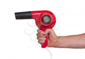 Old red hairdryer in hand isolated on white