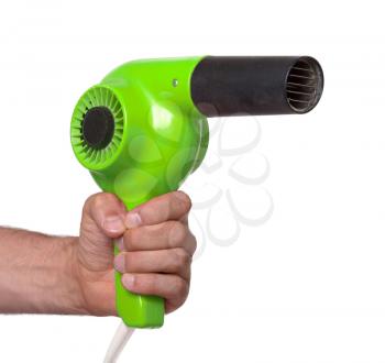 Old green hairdryer in hand isolated on white