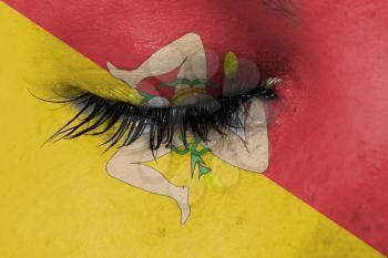Women eye, close-up, tear, flag of Sicily