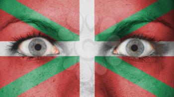 Women eye, close-up, eyes wide open, flag of Basque Country