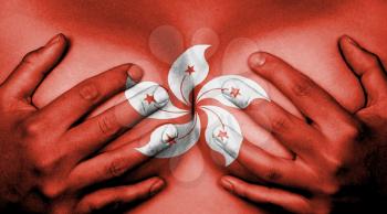 Upper part of female body, hands covering breasts, flag of Hong Kong