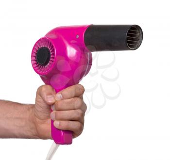Old pink hairdryer in hand isolated on white