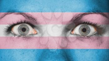 Women eye, close-up, eyes wide open, flag of Trans Pride