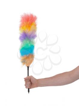 Soft colorful duster with plastic handle on a white background
