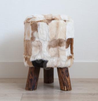 Small stool made of cowhide and wood