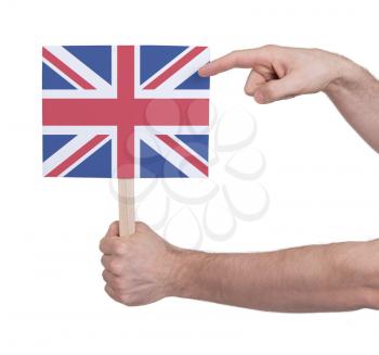 Hand holding small card, isolated on white - Flag of the UK