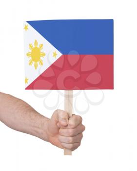 Hand holding small card, isolated on white - Flag of Philipines