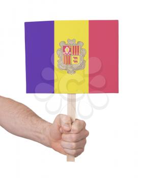 Hand holding small card, isolated on white - Flag of Andorra