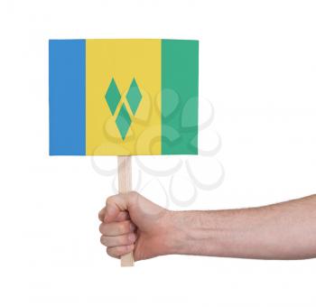 Hand holding small card, isolated on white - Flag of Saint Vincent and the Grenadines