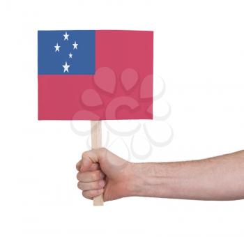 Hand holding small card, isolated on white - Flag of Samoa