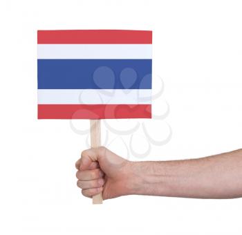 Hand holding small card, isolated on white - Flag of Thailand