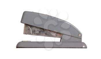 Old dirty stapler isolated on a white background