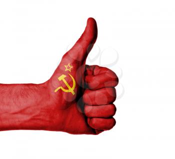 Closeup of male hand showing thumbs up sign, flag of USSR