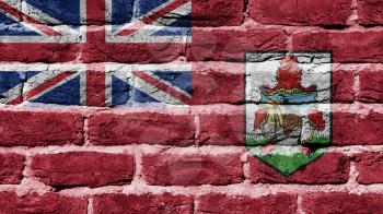 Very old dark red brick wall texture, flag of Bermuda
