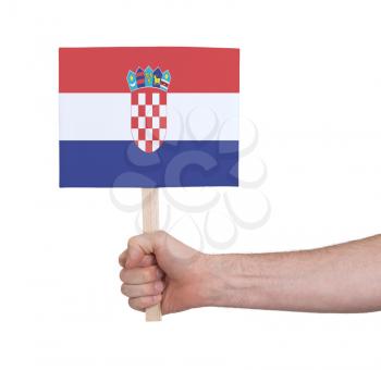 Hand holding small card, isolated on white - Flag of Croatia