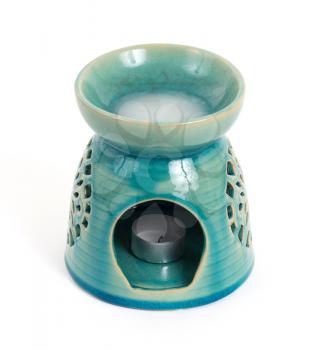 Candle in oil burner, isoalted on white