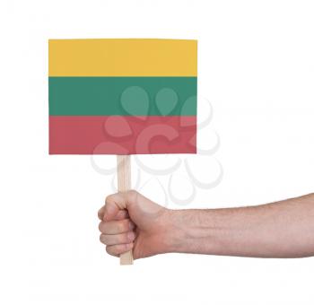Hand holding small card, isolated on white - Flag of Lithuania