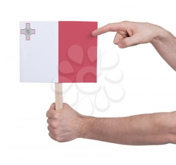 Hand holding small card, isolated on white - Flag of Malta