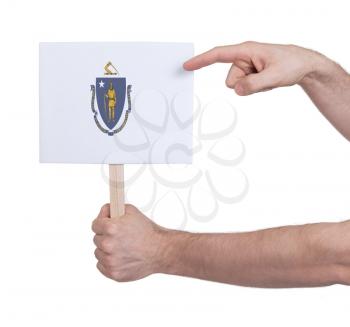Hand holding small card, isolated on white - Flag of Massachusetts