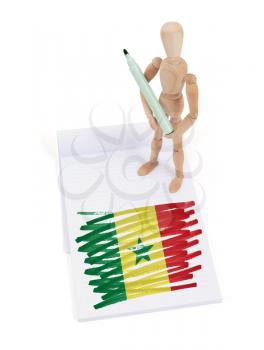 Wooden mannequin made a drawing of a flag - Senegal