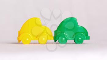 Toy cars in a row isolated on white background, accident