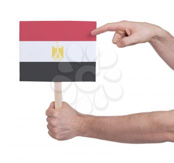 Hand holding small card, isolated on white - Flag of Egypt