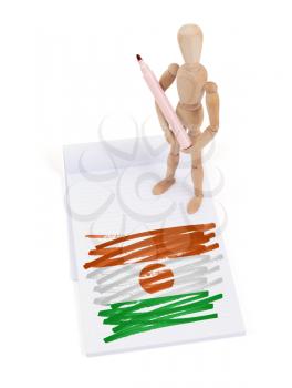 Wooden mannequin made a drawing of a flag - Niger