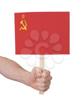 Hand holding small card, isolated on white - Flag of the USSR