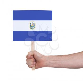 Hand holding small card, isolated on white - Flag of El Salvador