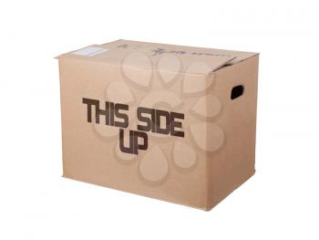 Closed cardboard box, isolated on a white background, this side up