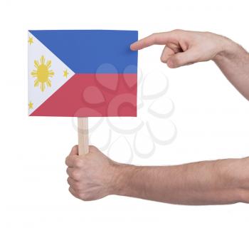 Hand holding small card, isolated on white - Flag of Philipines
