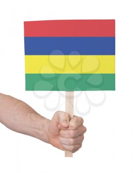 Hand holding small card, isolated on white - Flag of Mauritius