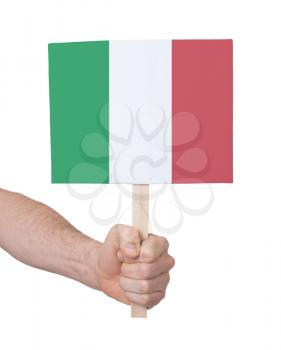 Hand holding small card, isolated on white - Flag of Italy