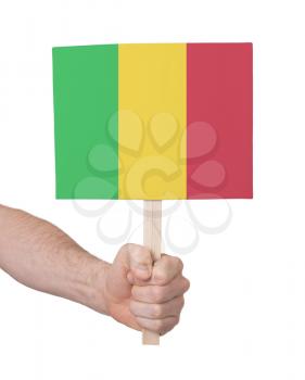 Hand holding small card, isolated on white - Flag of Mali