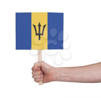 Hand holding small card, isolated on white - Flag of Barbados