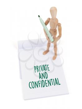 Wooden mannequin writing in a scrapbook - Private and confidential