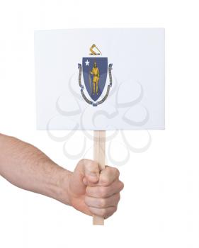 Hand holding small card, isolated on white - Flag of Massachusetts