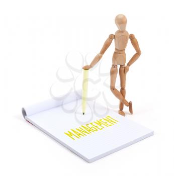 Wooden mannequin writing in a scrapbook - Management