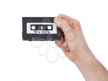 Vintage audio cassette tape, isolated on white background, 90's hits