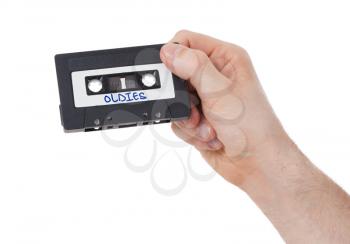 Vintage audio cassette tape, isolated on white background, oldies